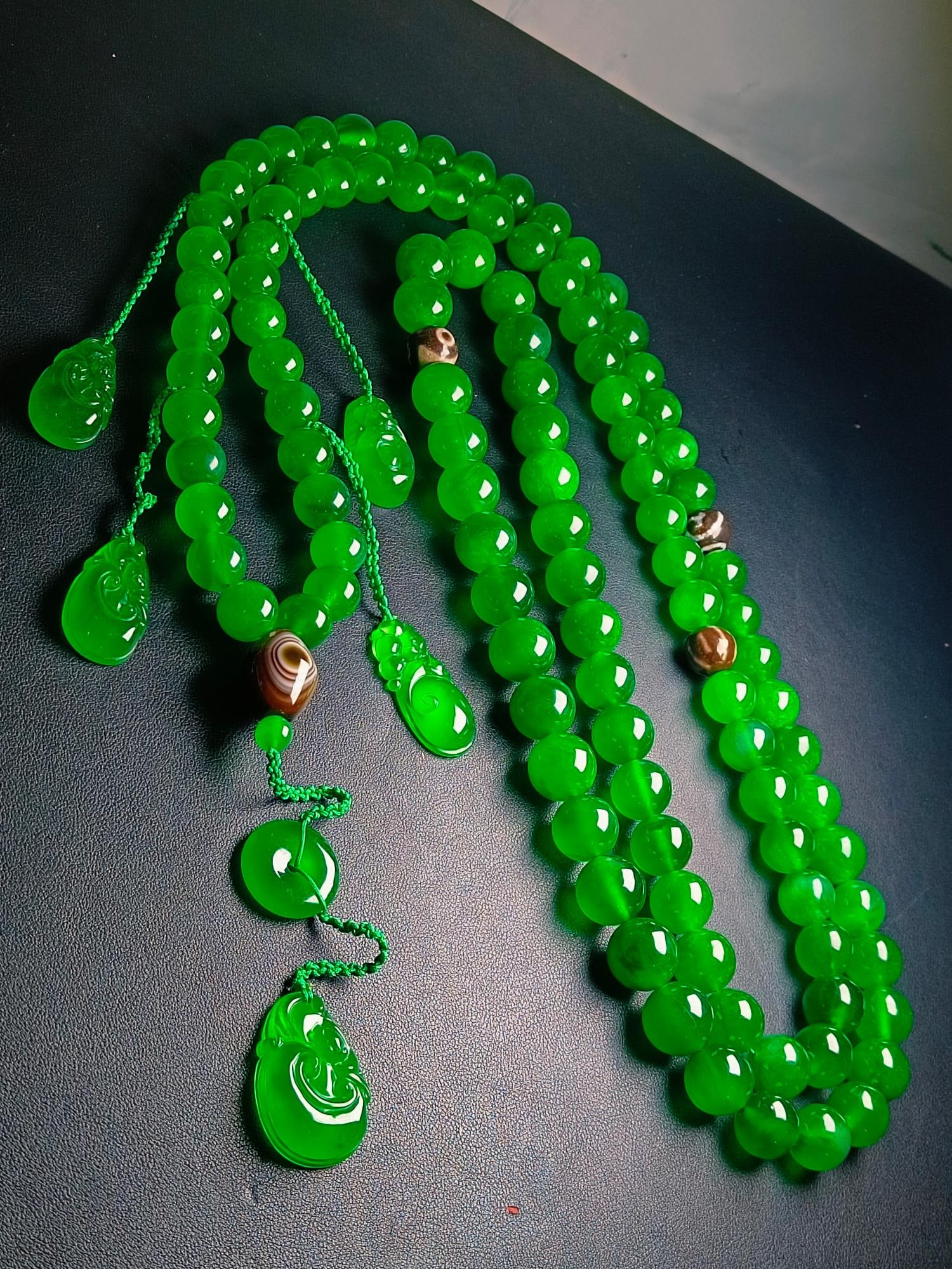A Dragon Stone Imperial Green Jadeite Court Bead: A Dragon Stone Imperial Green Jadeite Court Bead Provenance:Private collection from a professor in University of Cambridge. We have an in-house shipping department to ensure your post-purchase process