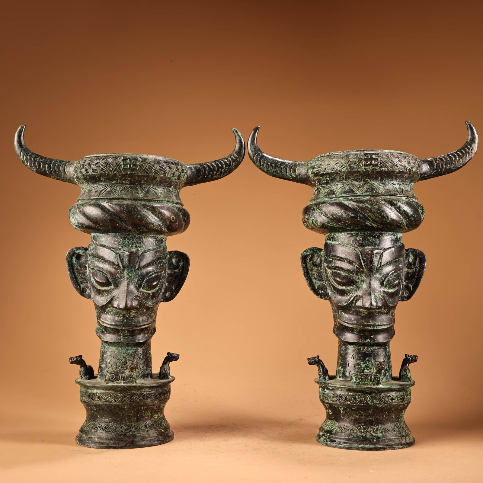 A pair of rare bronze ox-horn human-face drums from an old collection: Gilded bronze vessel with engraved inscription, 22 x 18 cm, 3400 g. Provenance:from the collection of George Stopher, Kent, purchased from P&M Waldo Antiques, London. We have an in-house shipping depa