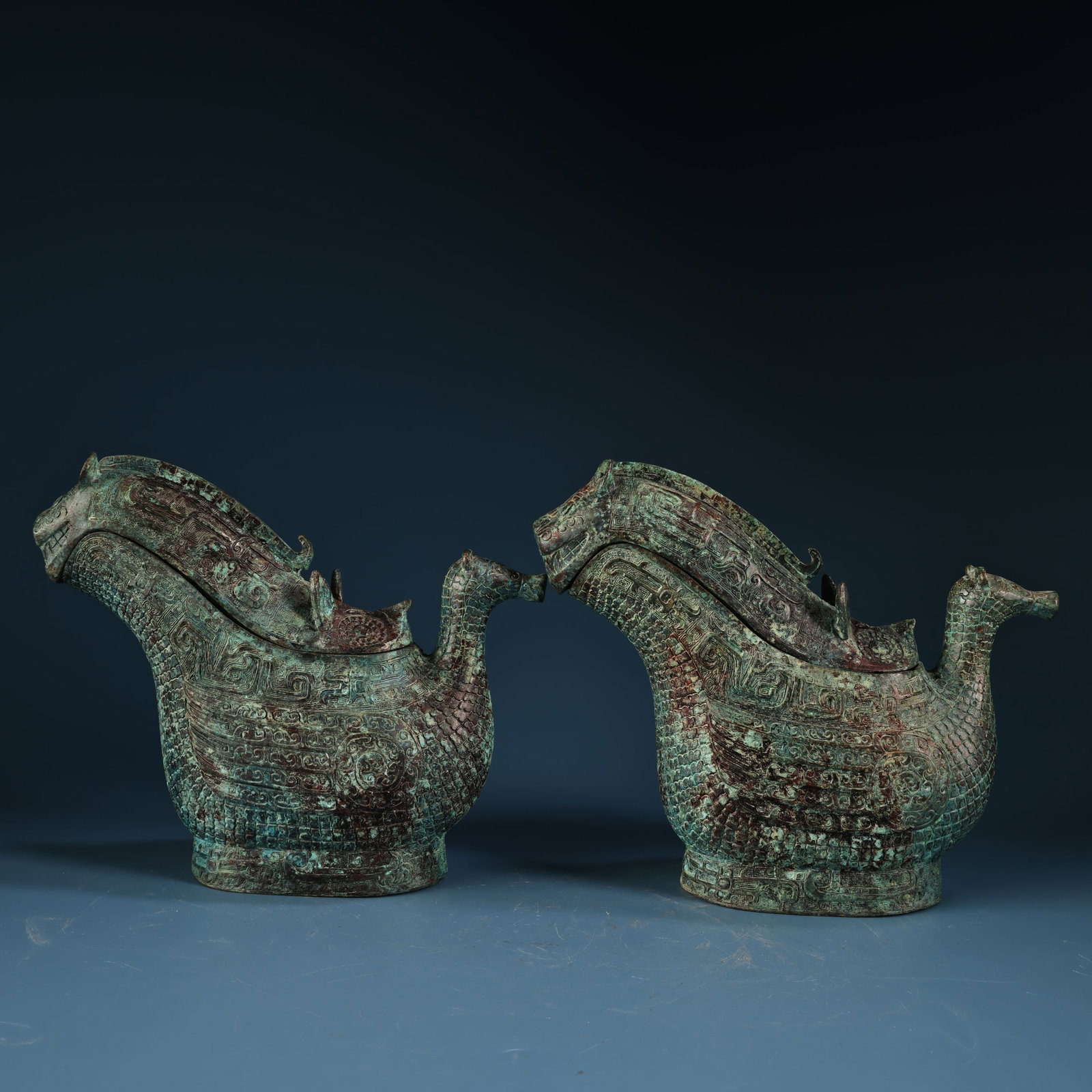 A pair of bronze animal-shaped covered cups from a rare collection.: A camel-shaped palace lamp, unearthed from the Western Zhou Dynasty, with gold leaf and bronze decoration, measuring 76 x 45 cm and weighing 19000g. Provenance:from the collection of George Stopher, K