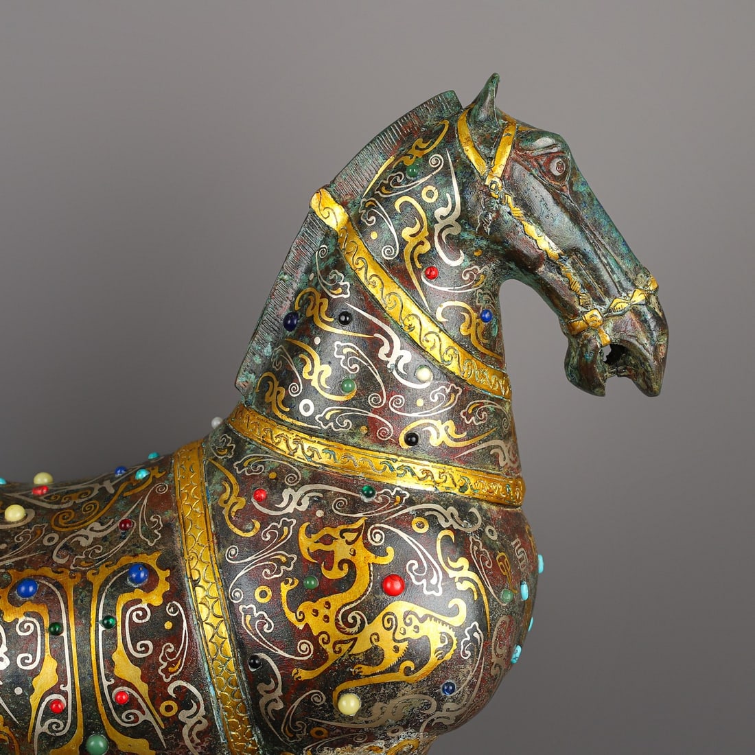 Han Dynasty Bronze Horse Inlaid with Gold: A set of seven bronze dancing girls inlaid with gold from the Han Dynasty, weighing a total of 27,195g. The tallest dancing girl is 18 cm long, 8 cm wide, and 54 cm high. The shortest dancing girl is 