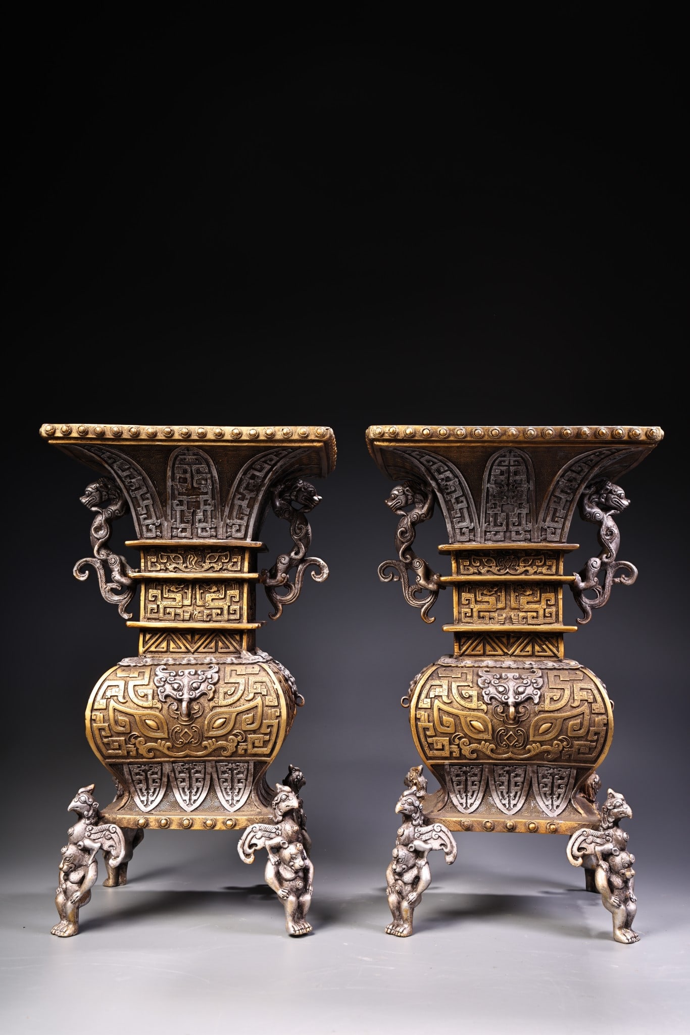 A pair of rare, antique pure copper square vases with high relief engraving, gilding, and gold and: A pair of exquisitely crafted, high-relief square vases, crafted from pure copper with gilding and silver accents, are from a rare collection. Each vase weighs 5000 grams, is 32 cm high, and 18.5 cm w