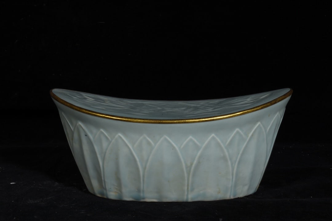 Song Dynasty Ding Kiln Gold-Inlaid Moon White Glazed Porcelain Pillow: Song Dynasty Ding ware moon-white glazed porcelain pillow with gold plating, measuring 8.6 x 20 cm. Provenance:Private collection, Manchester, The United Kingdom. We have an in-house shipping departme