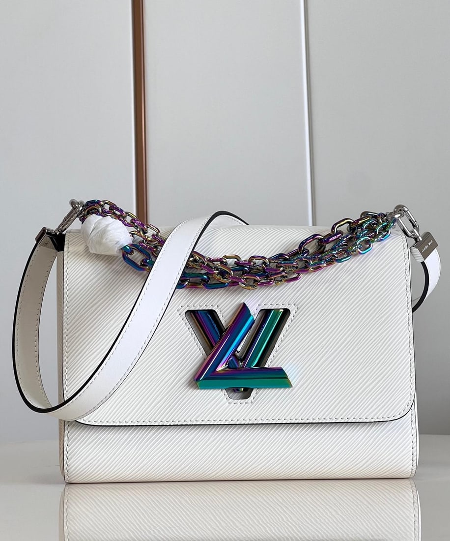 LV Twist: The medium-sized Twist handbag is crafted from Epi grain leather, featuring a beetle-like iridescent sheen on the LV Twist lock and chain handles. Part of the chain is integrated into the leather shou