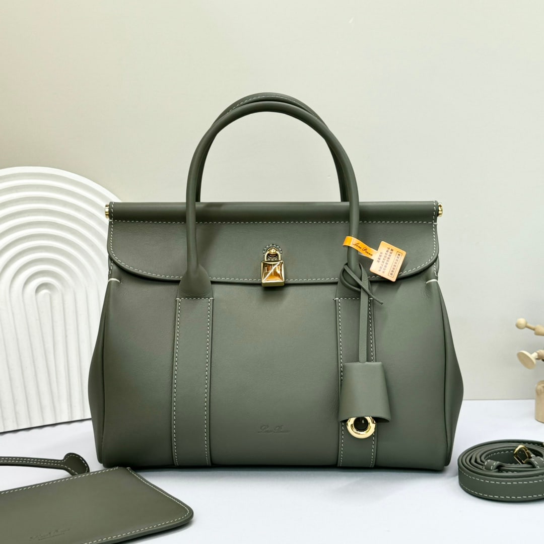 Loro piana Loro piana Loom L25 Handbag: The Loro Piana Loom L25 tote bag is crafted from distinctive calfskin leather with a suede lining, offering a unique and lightweight feel. It features a delicate padlock that can be opened, exuding a 
