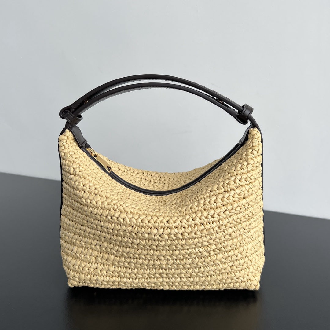 Bottega Veneta: The Bottega Veneta Walkace straw lunch bag exudes a vacation vibe. Made with raffia straw and leather, this lightweight and durable tote bag boasts a unique craftsmanship. The canvas lining adds a sof