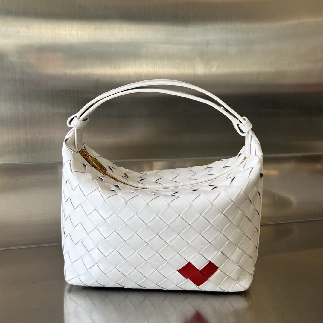 Bottega Veneta: The Bottega Veneta Wallace Valentine's Day limited edition lunchbox bag is a must have. Crafted using the classic intrecciato weave technique, it embodies Bottega's artisan spirit. The entire bag is