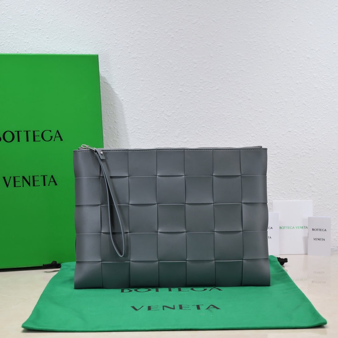 Bottega Veneta: Bottega Veneta 2022 Large Woven Lambskin Handbag. This handbag continues the iconic woven craftsmanship of previous models. The leather is exquisitely fine and incredibly soft to the touch. The