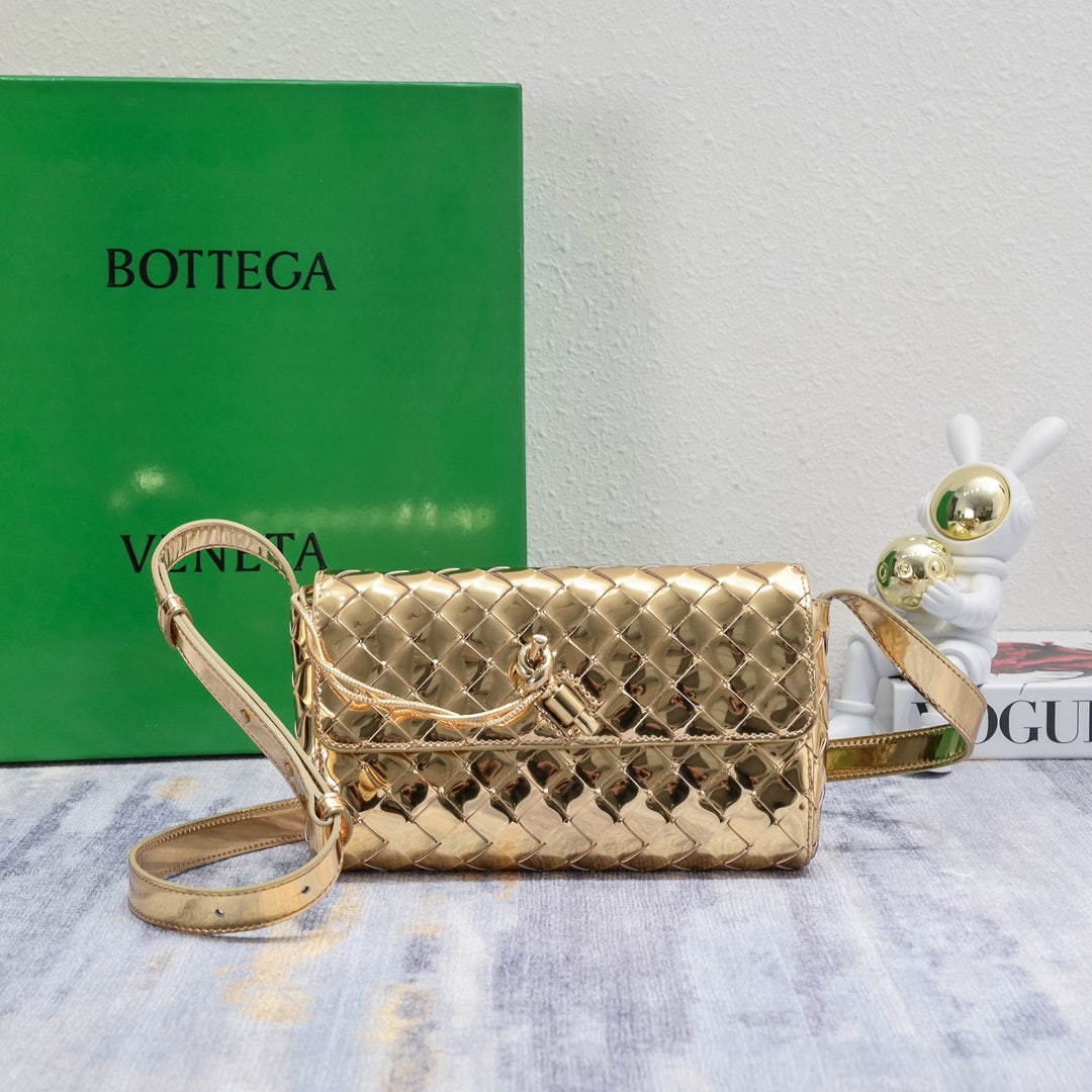 Bottega Veneta: The Bottega Veneta mini Andiamo bag is absolutely gorgeous! The deep brown color is so versatile and exudes a sophisticated yet casual vibe. The Andiamo isn't just for work; it can be worn crossbody