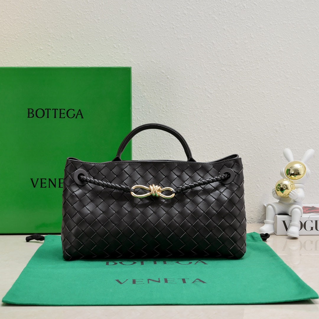 Bottega Veneta: The Bottega Veneta Andiamo horizontal handbag, a favorite among many celebrities, features a classic all over leather woven design with a gold rope knot clasp, exuding both sophistication and
