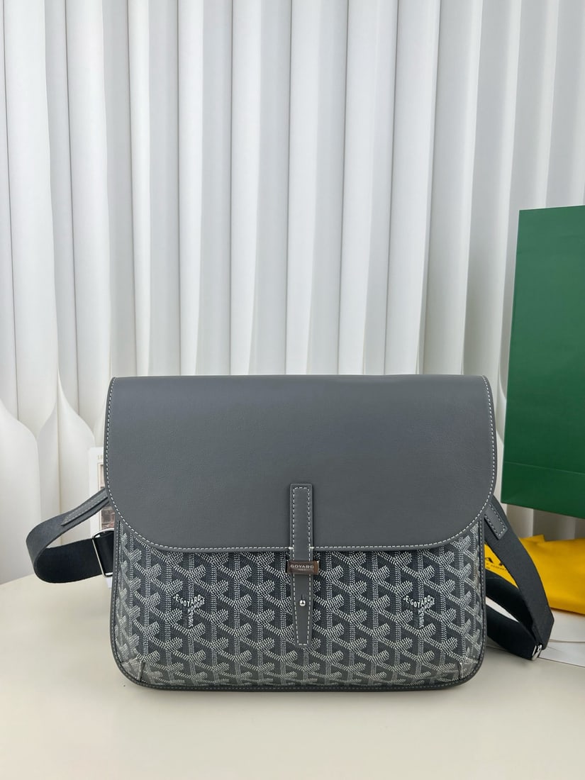 Goyard coursier: The Goyard coursier crossbody messenger bag features a top grain calfskin flap that is suede underneath, giving it a premium feel. The body is made of Goyardine canvas, with hard pack style binding