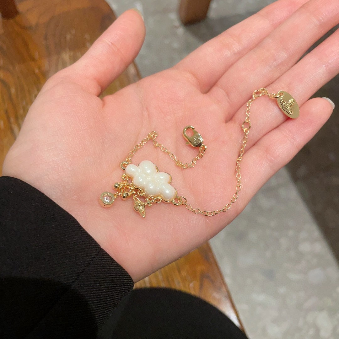 Vivienne Westwood Cloud Bracelet: The Vivienne Westwood cloud bracelet is so delicate; it's a small and exquisite piece that's perfect for layering with other delicate jewelry. If you haven't tried Vivienne Westwood before, you