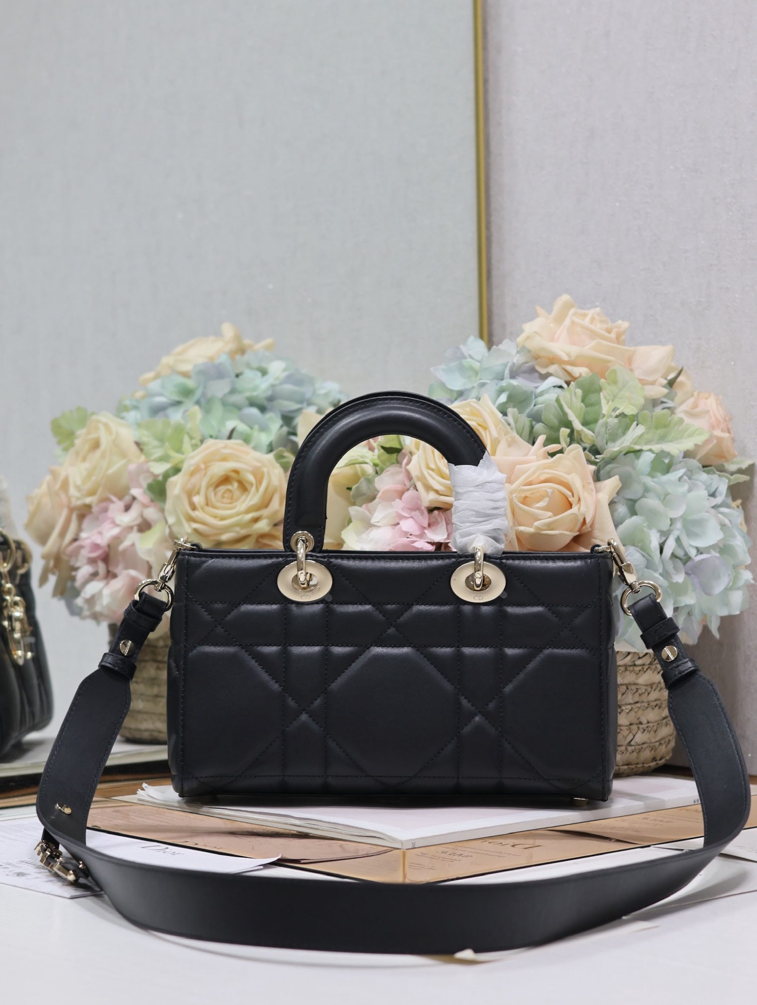 Christian Dior Lady Dior: The small, black, plain grain calfskin Lady D Sire My ABCDior handbag made its stunning debut in the Spring/Summer 2024 ready to wear collection, drawing inspiration from the classic elegance of the