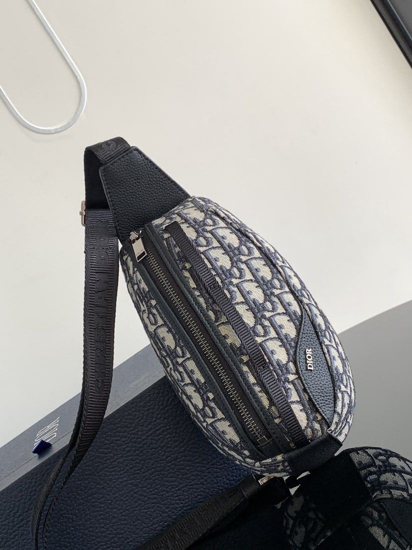 Christian Dior Scarab: The Dior Scarab handbag is a striking piece that seamlessly blends technological expertise with haute couture craftsmanship. Crafted from beige and black Oblique printed fabric and finished with