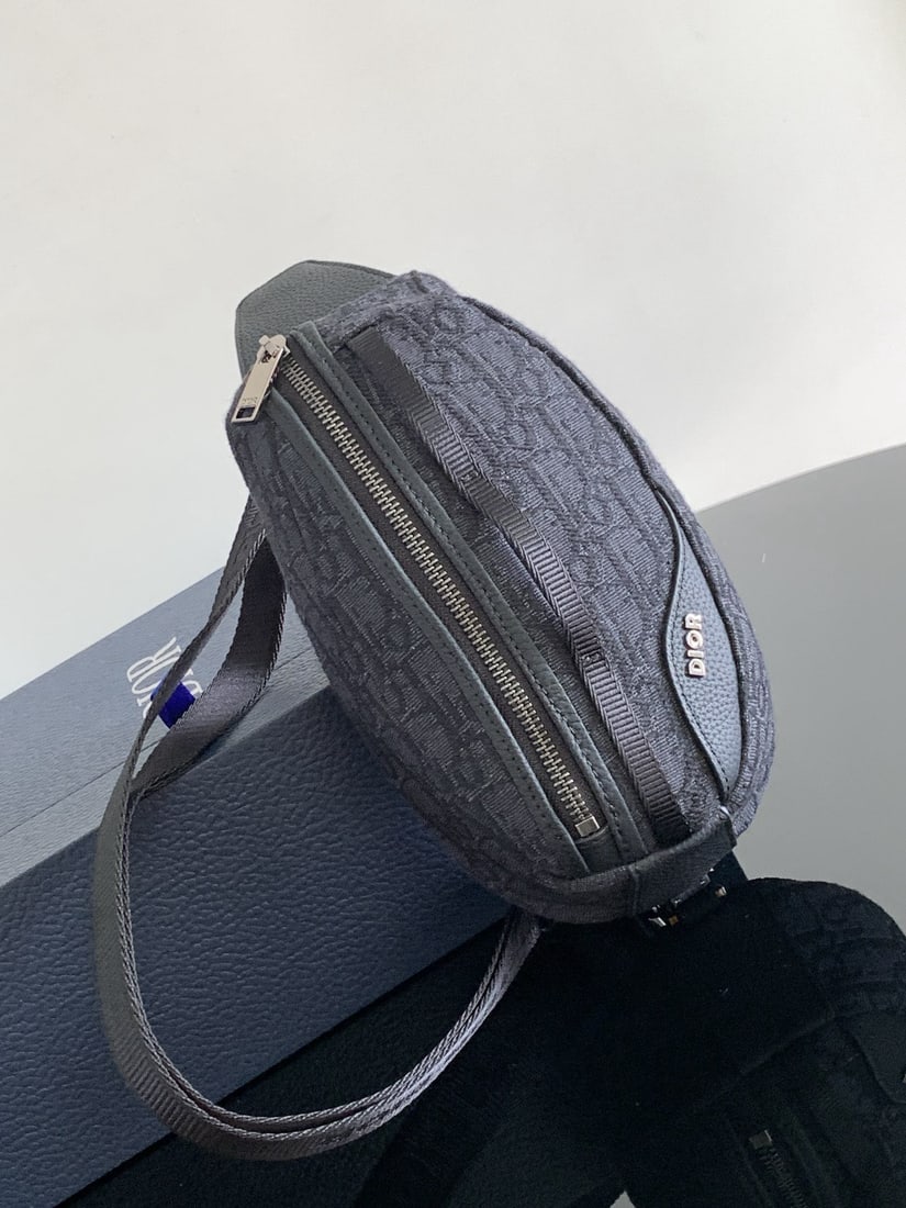 Christian Dior Scarab: The Dior Scarab handbag is a striking piece that seamlessly blends technological expertise with haute couture craftsmanship. Crafted from black Oblique printed fabric and finished with tonal grained