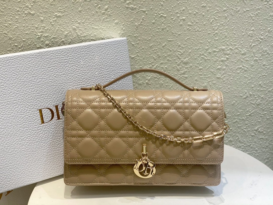 Christian Dior MISS DIOR: The Miss Dior handbag, crafted from biscuit colored lambskin in a cannage pattern, is part of the 2024 Early Spring collection. Elegant and practical, it features meticulous craftsmanship in biscuit c