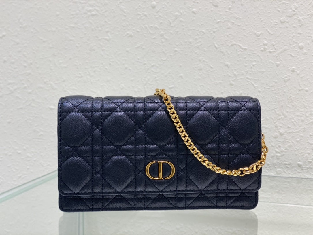 Christian Dior Caro: The Dior Caro chain handbag is both practical and elegant. Crafted from supple black calfskin with cannage stitching, it features a vintage gold tone metal CD logo flap and a single compartment for