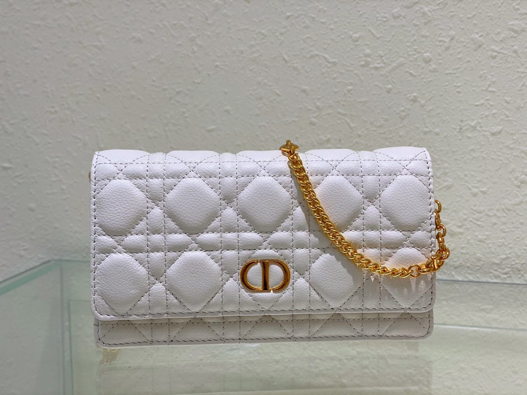 Christian Dior Caro: The Dior Caro chain handbag is both practical and elegant. Crafted from supple cream colored calfskin leather with cannage stitching, it features a vintage gold tone metal CD logo flap and a single co