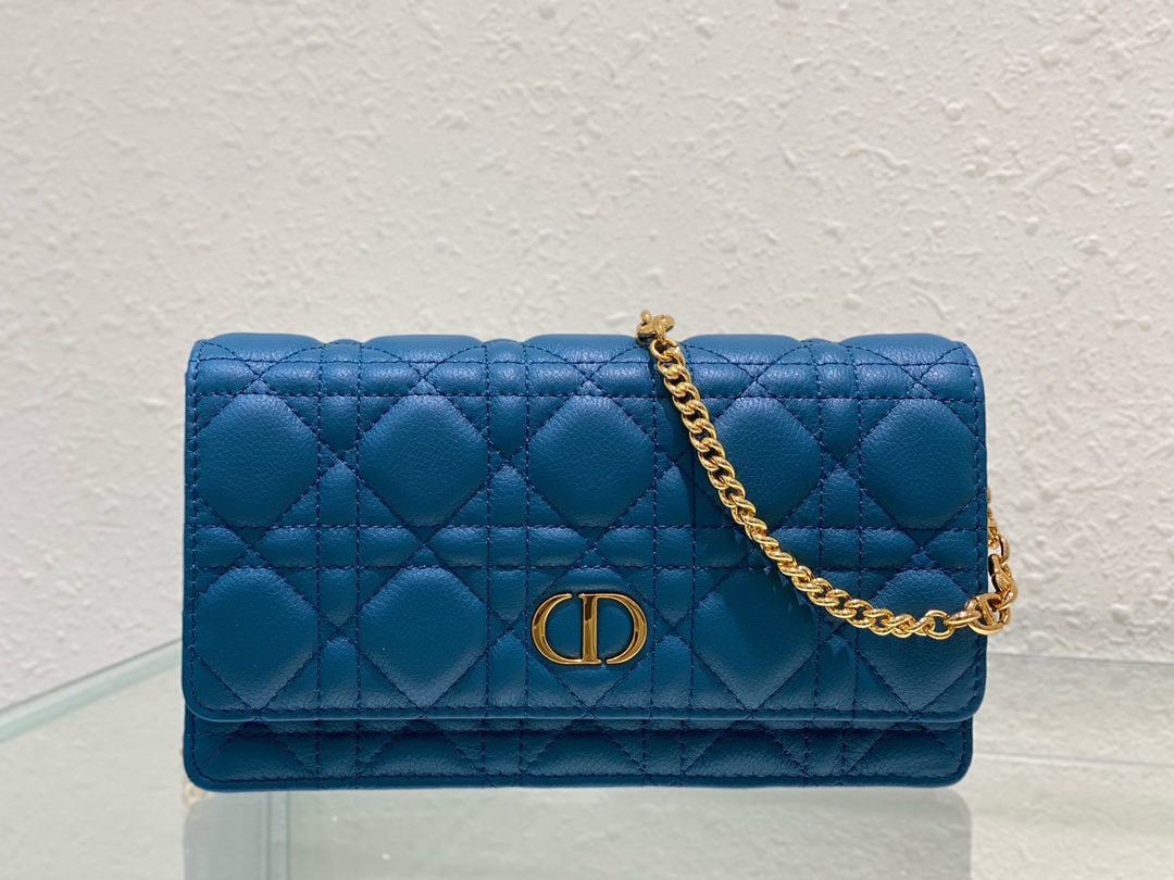Christian Dior Caro: The Dior Caro chain handbag is both practical and elegant. Crafted from supple navy blue calfskin leather with cannage stitching, it features a vintage gold plated CD logo flap and a single