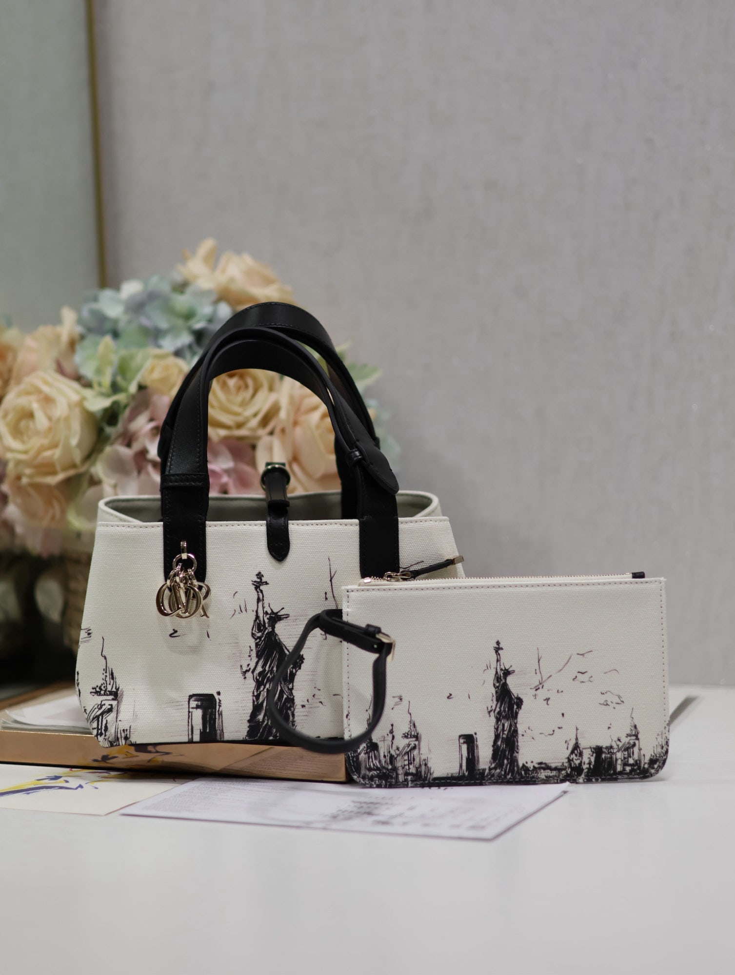 Christian Dior TOUJOURS: Dior Toujours Statue of Liberty Handbag (Small, Canvas and Leather) The Dior Toujours handbag made a stunning debut in the Spring/Summer 2024 collection, showcasing a unique blend of casual and practi