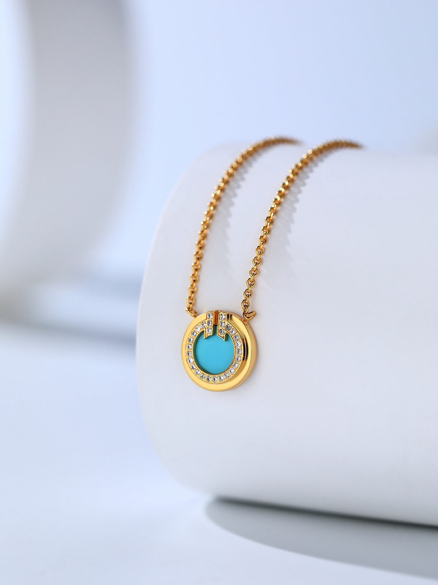 Circle T shaped mini necklace: This round T shaped mini necklace is a very beautiful design. It features natural gemstones and a unique, novel design that accentuates the wearer's petite and elegant features. A classic T series pie