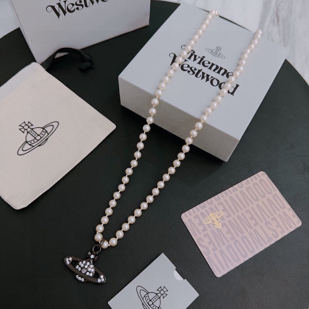 Vivienne Westwood's classic Saturn Necklace: Vivienne Westwood classic Saturn necklace, unisex (60cm). A pearl necklace by Vivienne Westwood, the British fashion designer known as the "mother of punk" in fashion. High quality, beautifully design