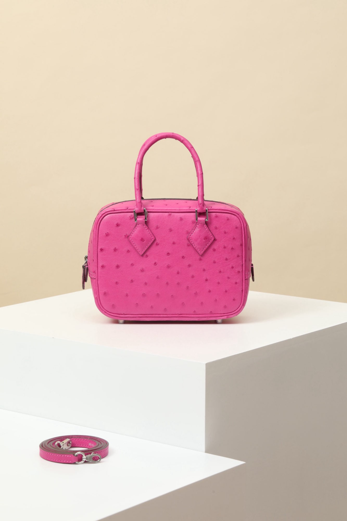 Hermes: Model: PL18 Code: PL180500 Color: E5 Candy Pink Dimensions: Length 18cm x Depth 13cm x Width 6.5cm Shoulder Strap Length: Approx. 89.5cm Mini Plume Ostrich Leather Crossbody Bag Detachable shoulder st