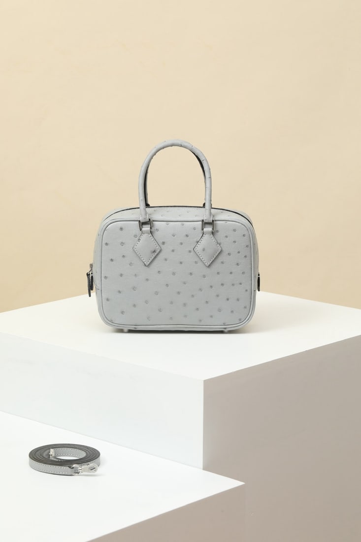 Hermes: Model: PL18 Code: PL180500 Color: 8L Glacier White Dimensions: Length 18cm x Depth 13cm x Width 6.5cm Shoulder Strap Length: Approx. 89.5cm Mini Plume Ostrich Leather Crossbody Bag Detachable shoulder