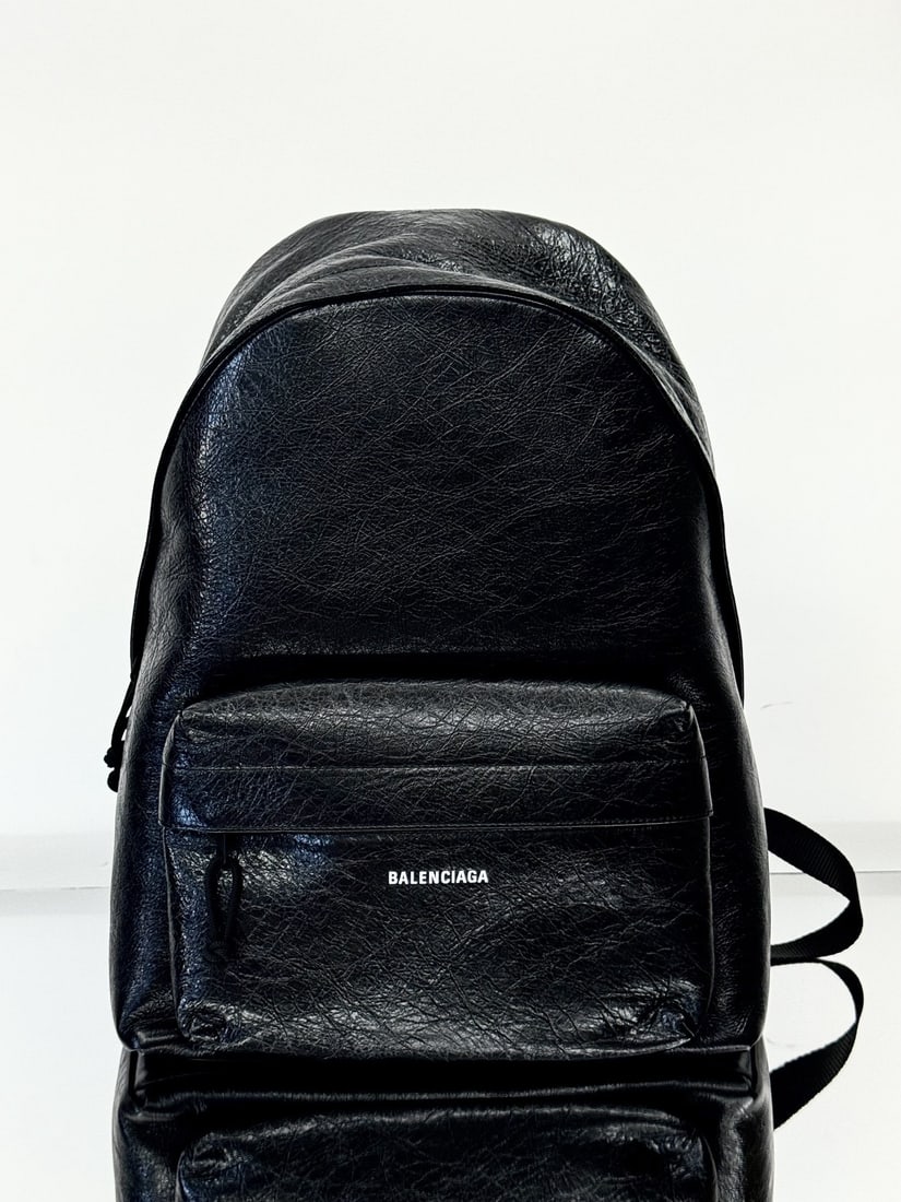 Balenciaga oil waxed leather backpack: This black Balenciaga Explorer series oil waxed leather backpack is a testament to the well known design philosophy of backpacks: to free up your hands and provide lightweight comfort. Made of soft co