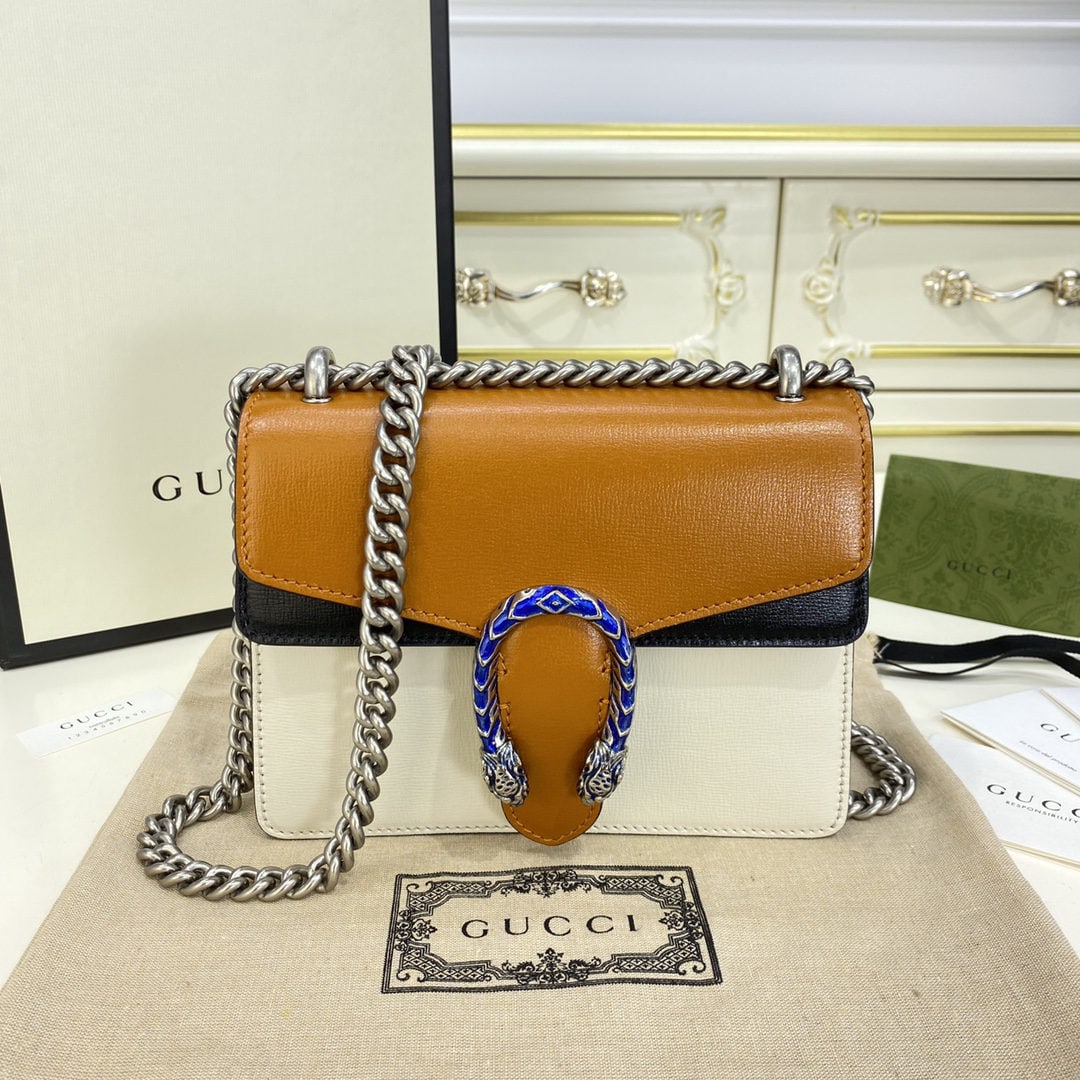 GUCCI Dionysus: The GUCCI Dionysus mini handbag in burnt orange is inspired by ancient Greek mythology and is renowned for its distinctive double tiger head clasp. On this handbag, the classic double tiger head clasp