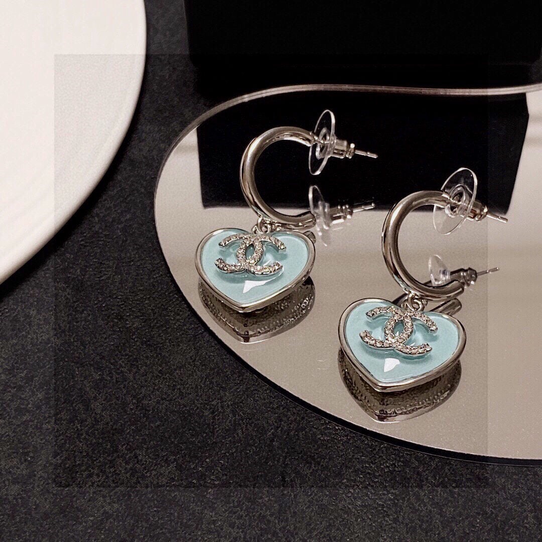 Chanel classic crystal heart shaped double C stud earrings: Chanel's classic crystal heart double C stud earrings are incredibly versatile and stylish, perfect for everyday wear. They flatter the face shape, exude sophistication and elegance. Chanel earrings a