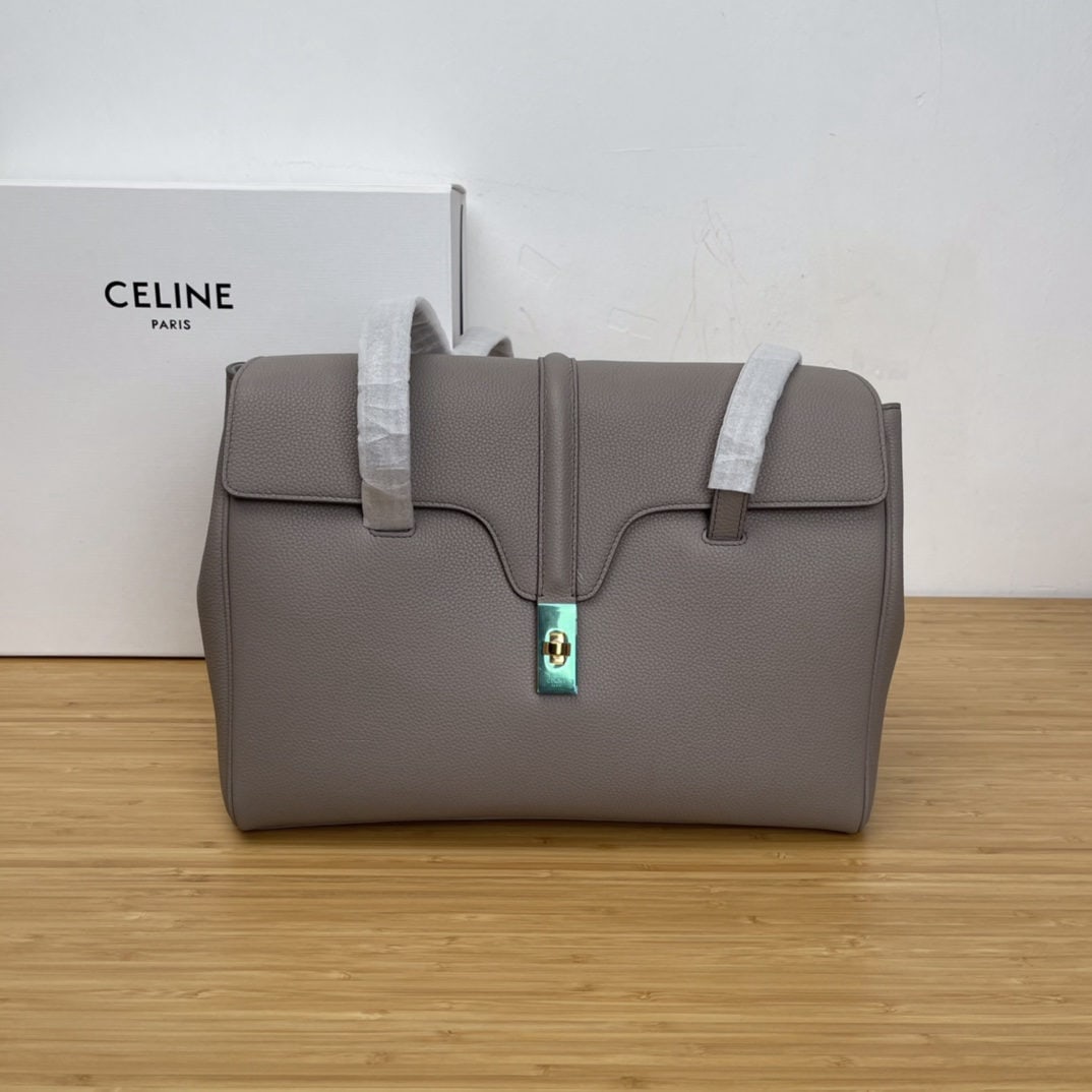 Celine: Soft16 Medium Grey Grained Calfskin Leather Handbag 13 x 9 x 6 inches (32 x 24 x 15 cm) Calfskin Leather Lining: Calfskin Leather Fabric Shoulder Turn lock Closure Interior Flat Pocket 2 Interior