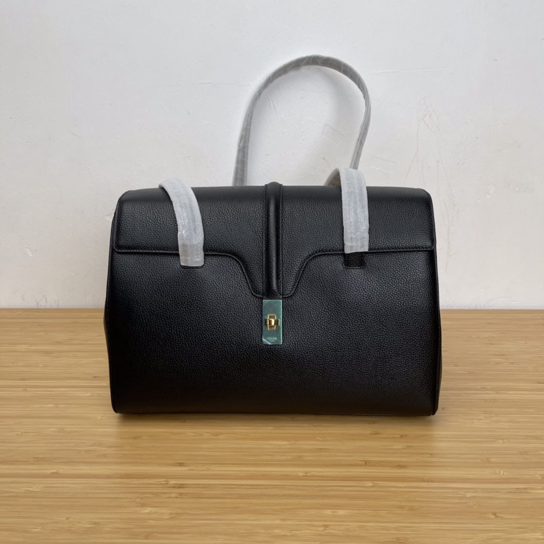 Celine: Soft16 Medium Black Grained Calfskin Leather Handbag 13 x 9 x 6 inches (32 x 24 x 15 cm) Calfskin Leather Lining: Calfskin Leather Fabric Shoulder Turn lock Closure Interior Flat Pocket 2 Interior