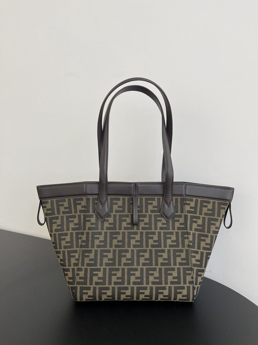 Fendi Origami: The medium sized Origami magic bag features classic dark brown calfskin leather, exuding a luxurious feel. Eight hidden magnetic clasps allow the bag to cleverly transform into a tote or fold into an 