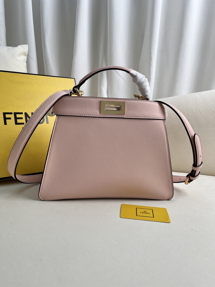 Fendi Peekaboo ISeeU: The pink medium sized Peekaboo Iseeu leather handbag, also known as the Iconic Peekaboo ISeeU, is crafted from brown leather and features classic twist locks on both sides. It has a soft Nappa leather