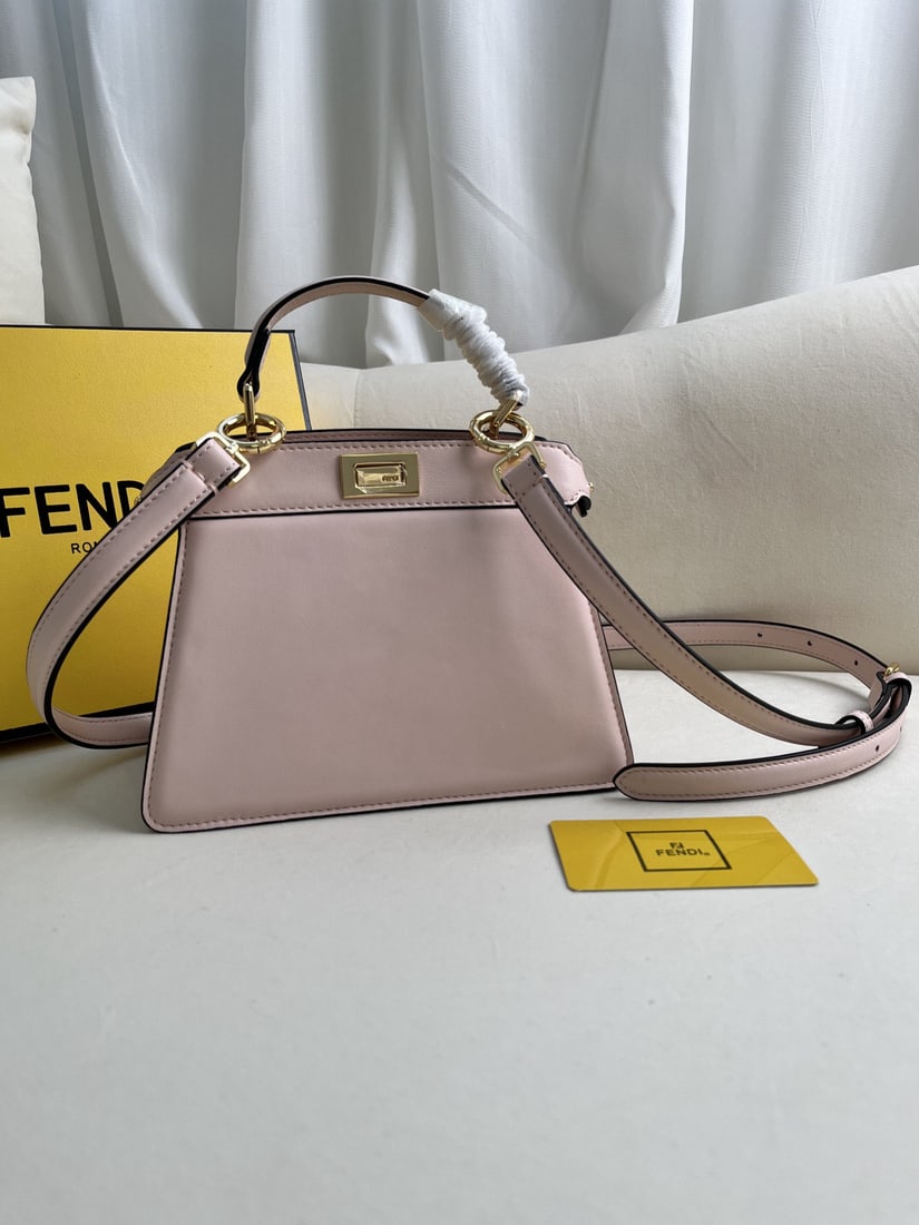 Fendi Peekaboo ISeeU: The pink Peekaboo ISeeU Petite is a small and adorable Iconic Peekaboo ISeeU handbag made of light blue, layered Nappa leather. It features classic twist locks on both sides. The interior is lined in 