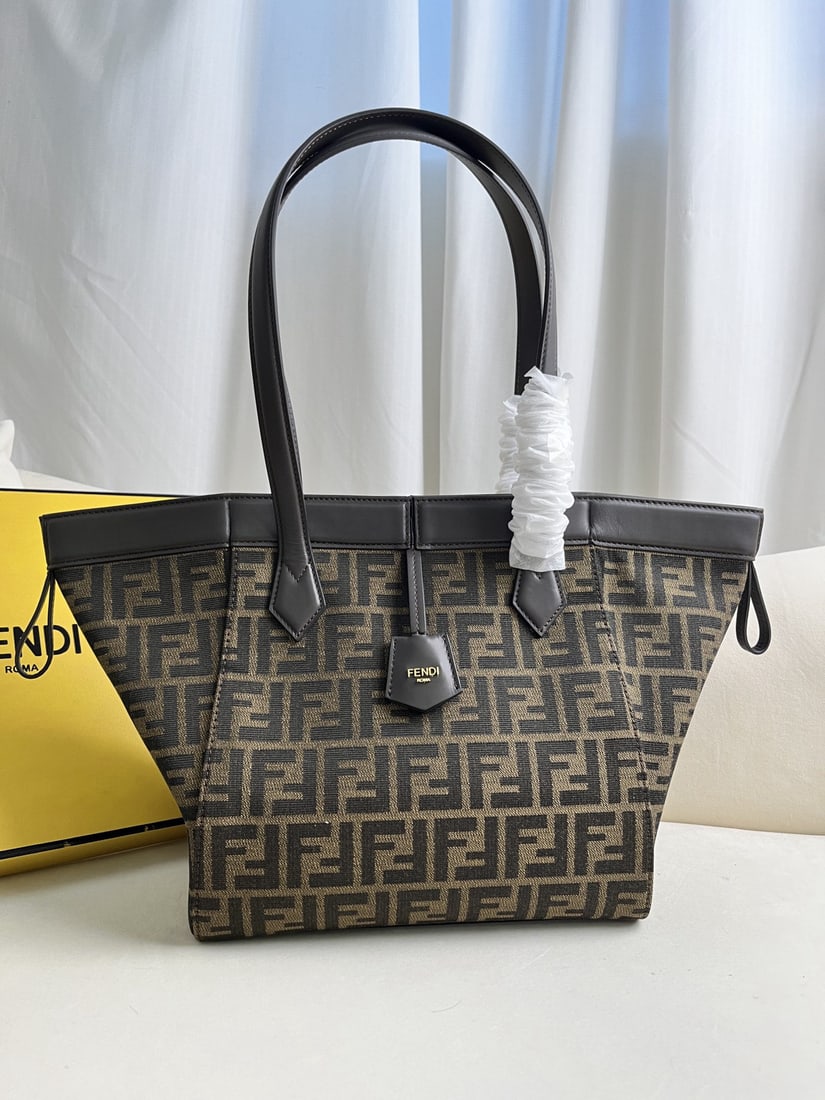 Fendi Origami: The medium sized Origami magic bag features classic dark brown calfskin leather, exuding a luxurious feel. Eight hidden magnetic clasps allow the bag to cleverly transform into a tote or fold into an 
