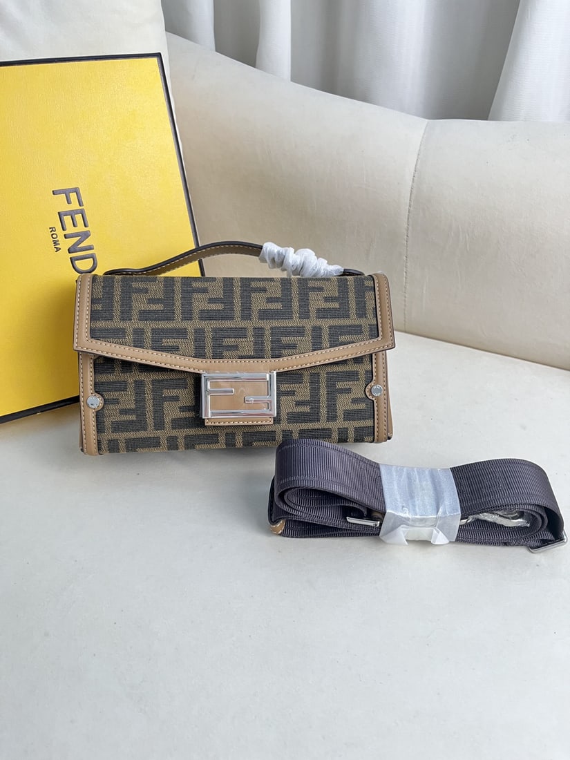 Fendi: This FENDI retro box bag is incredibly stylish and a must have versatile piece. Made of calfskin and classic fabric, it features a long shoulder strap and handles for added style! Highly versatile for