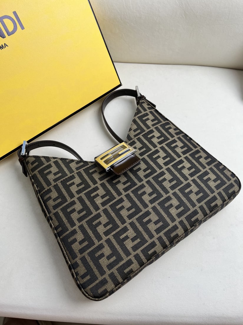 Fendi Vintage: This vintage FENDI underarm bag with silver hardware is truly a gem. Regardless of its size or strap length, it's always stylish when worn under the arm. A timeless classic, its simple design compleme
