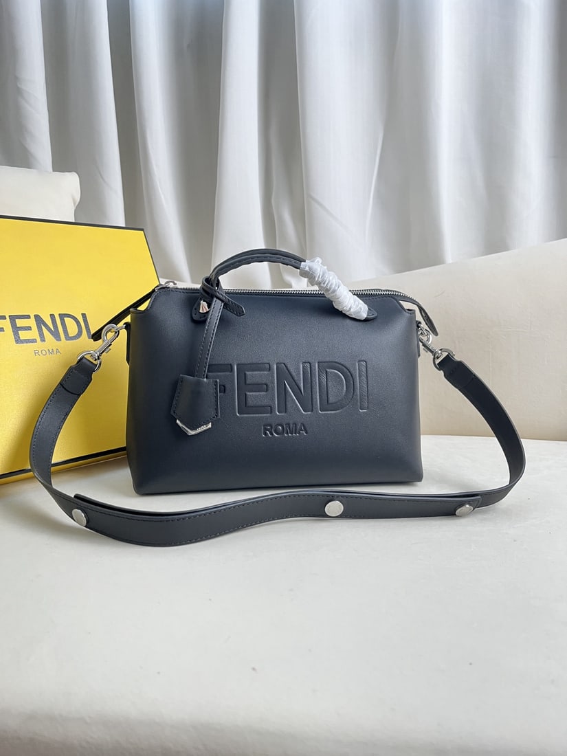 Fendi ?BY THE WAY: Black embossed BY THE WAY zip lock Boston tote bag, with a double handle design and embellished with a plaque. The interior features two pockets separated by a divider, plus an additional pocket. Adju