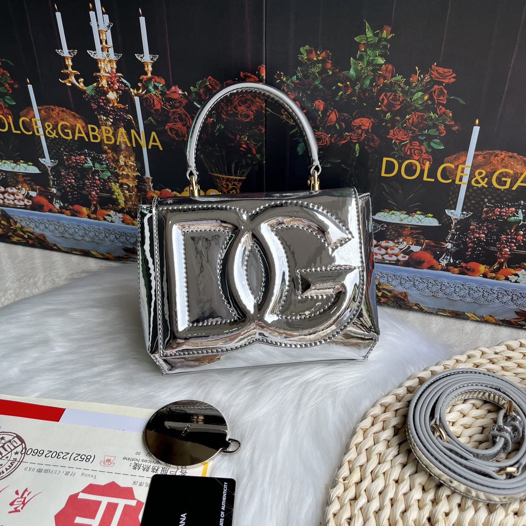 Dolce & Gabbana: Dolce & Gabbana's exquisite handcrafted leather bag features a calfskin body with hand painted edges for a structured look. The quilted DG logo adds a touch of modern style, making it a favorite among