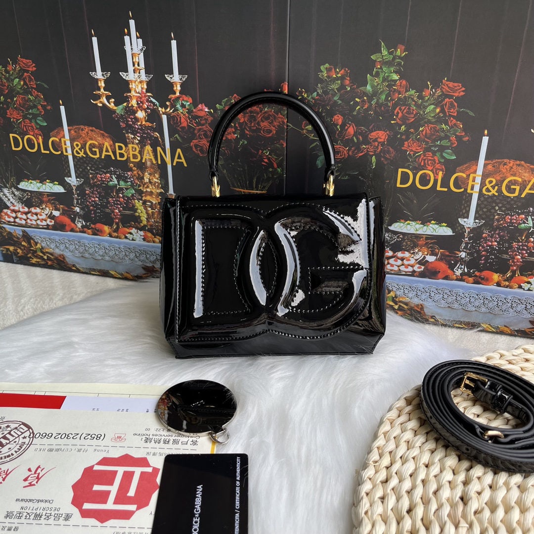 Dolce & Gabbana: Dolce & Gabbana's exquisite handcrafted leather bag features a calfskin body with hand painted edges for a structured look. The quilted DG logo adds a touch of modern style, making it a favorite among