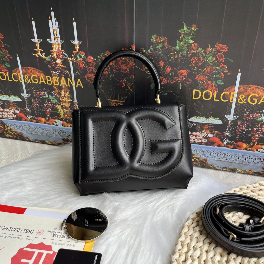Dolce & Gabbana: Dolce & Gabbana's exquisite handcrafted leather bag features a calfskin body with hand painted edges for a structured look. The quilted DG logo adds a touch of modern style, making it a favorite among