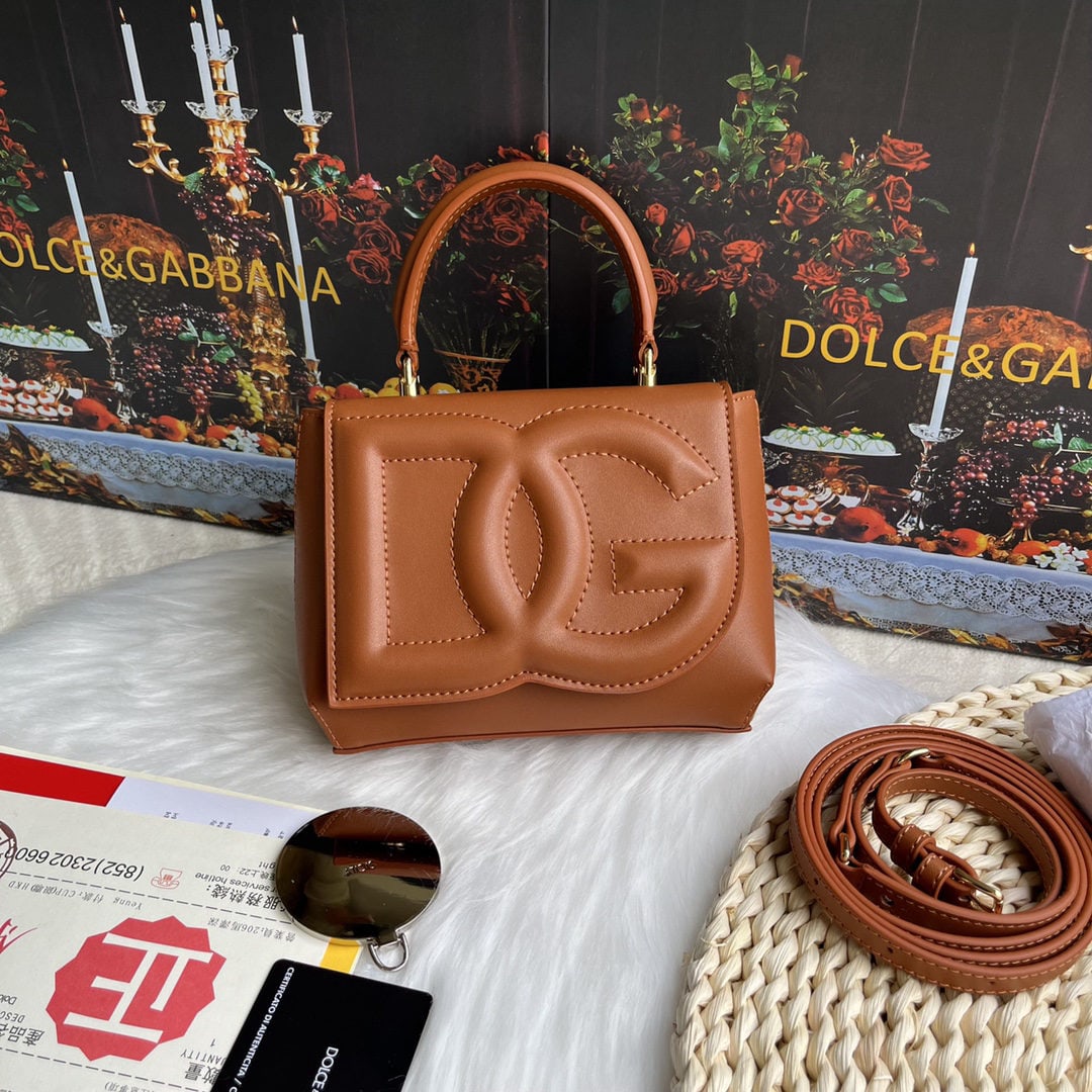 Dolce & Gabbana: Dolce & Gabbana's exquisite handcrafted leather bag features a calfskin body with hand painted edges for a structured look. The quilted DG logo adds a touch of modern style, making it a favorite among