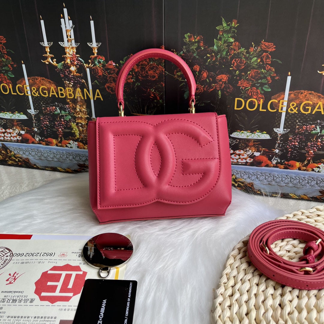 Dolce & Gabbana: Dolce & Gabbana's exquisite handcrafted leather bag features a calfskin body with hand painted edges for a structured look. The quilted DG logo adds a touch of modern style, making it a favorite among