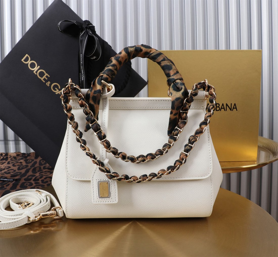 Dolce & Gabbana Sicily: The iconic Dolce & Gabbana Sicily collection is now presented in a compact version, offering easy storage for frequently used items. Its unique design features a hidden magnetic closure on the front f