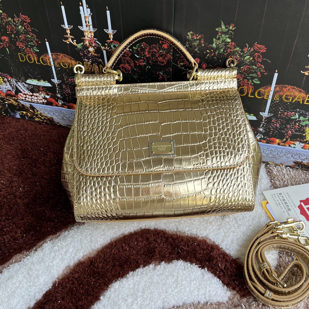 Dolce & Gabbana: Dolce & Gabbana crocodile embossed bag. Exquisite craftsmanship. Perfectly embossed top grain cowhide leather, 25cm wide for crossbody wear. Very practical; easily fits a long wallet, cosmetic bag, ph