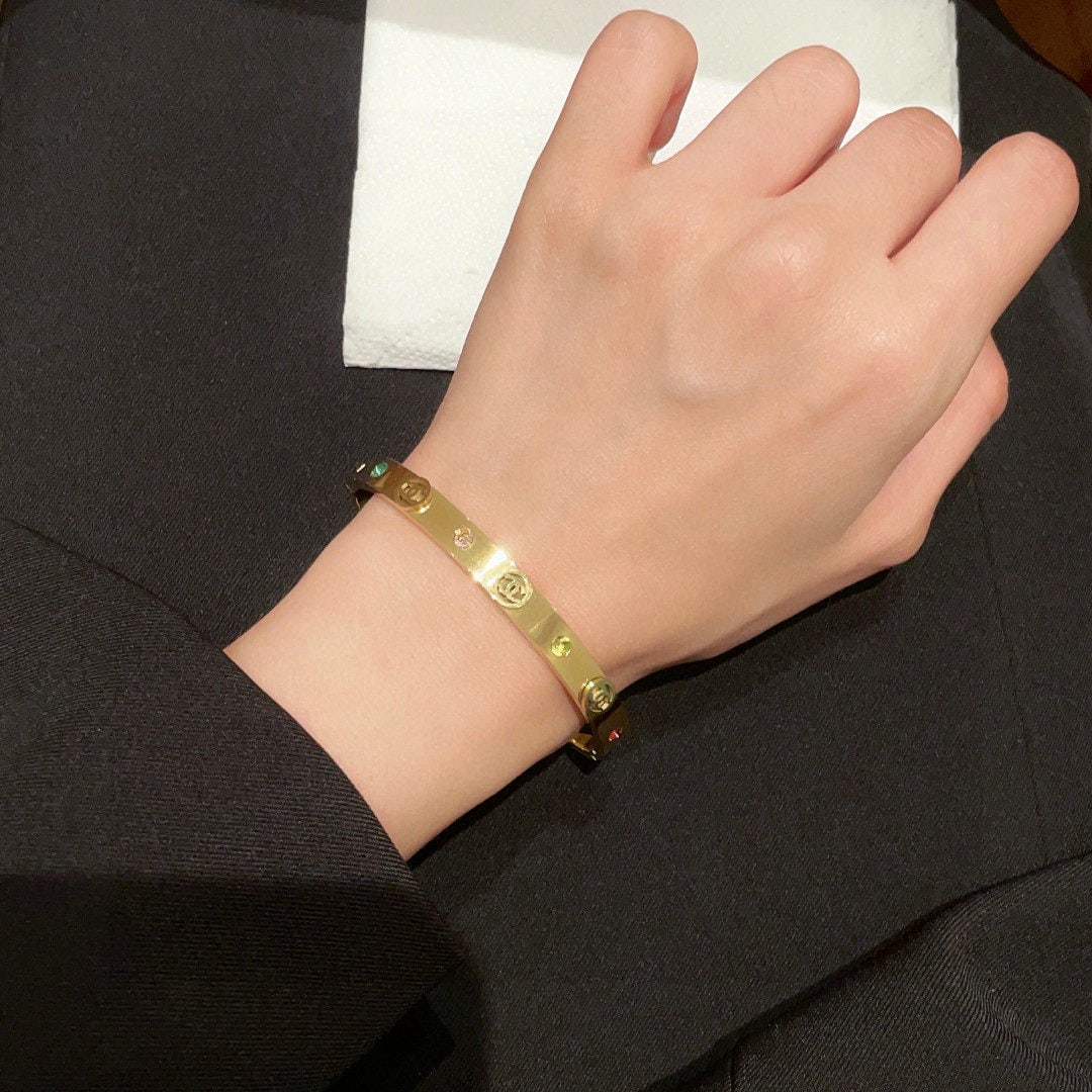 Chanel double C diamond set bracelet: The Chanel double C diamond bangle has a beautifully matched color scheme, exuding a sophisticated and goddess like aura. It's a high end, classic, and incredibly alluring piece with excellent value f
