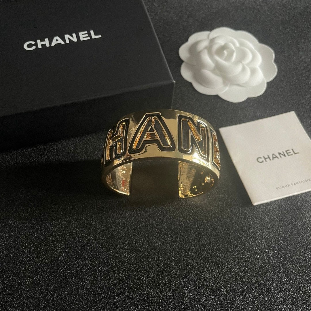 CHANEL openwork letter bracelet: The CHANEL openwork letter bracelet has a beautifully matched color scheme, exuding a sophisticated and goddess like aura. It's a high end, classic, and incredibly charming piece with excellent value 