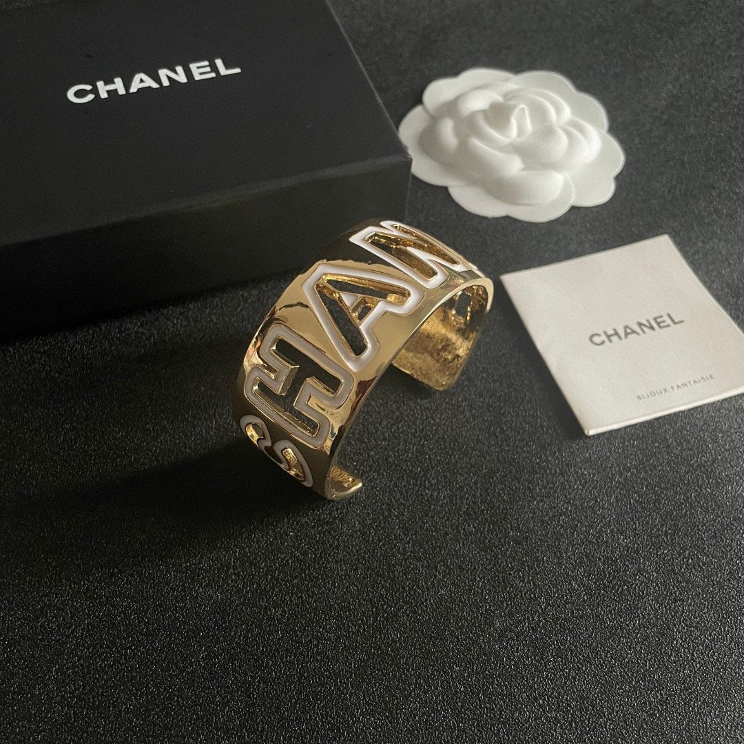 CHANEL openwork letter bracelet: The CHANEL openwork letter bracelet has a beautifully matched color scheme, exuding a sophisticated and goddess like aura. It's a high end, classic, and incredibly charming piece with excellent value 
