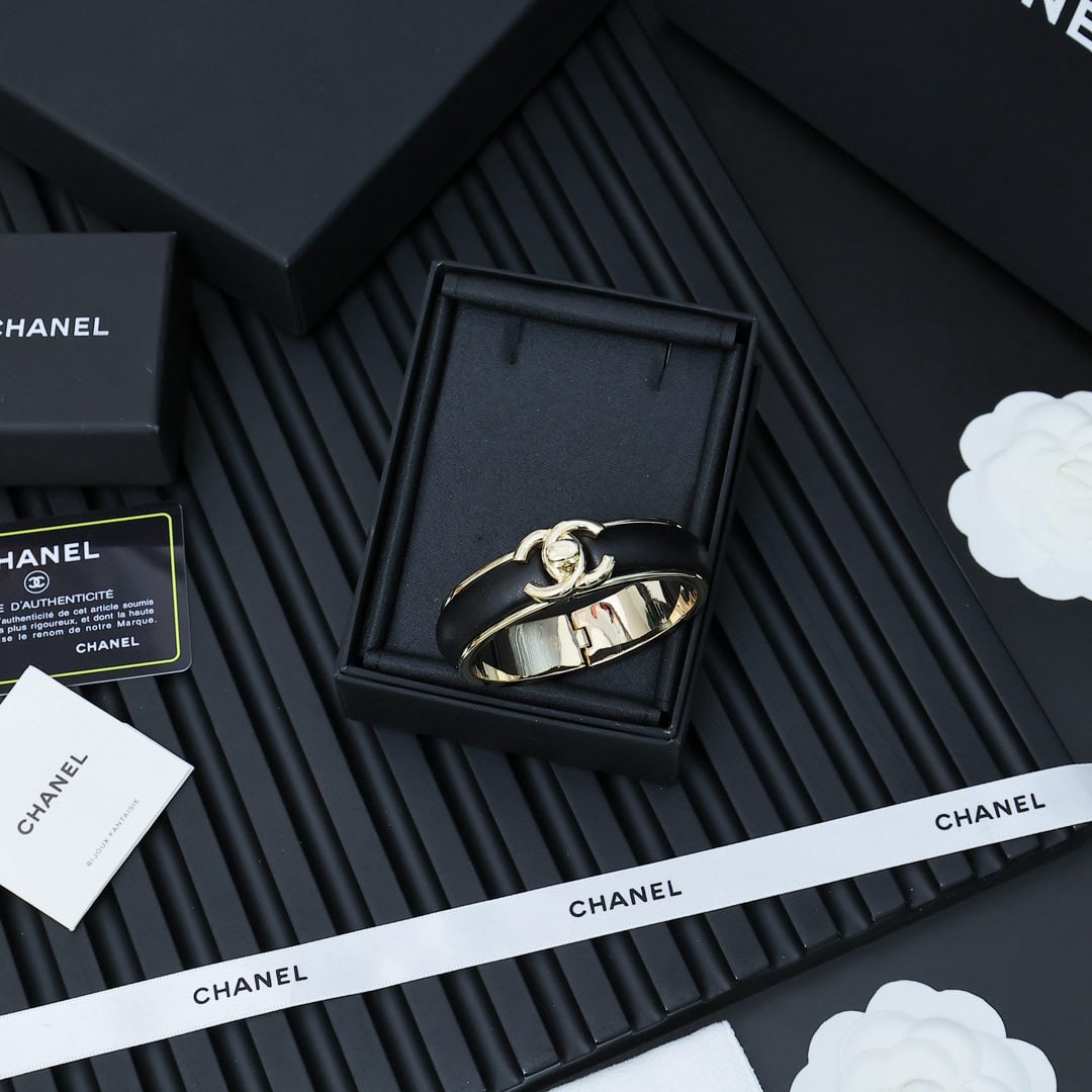 Chanel satin bag buckle lambskin bracelet: Chanel satchel buckle lambskin bracelet ?C a rare find, exuding chic and sophistication. Chanel satchel buckle lambskin bracelet, a collector's item, versatile and elegant in black. We offer FREE SHIP